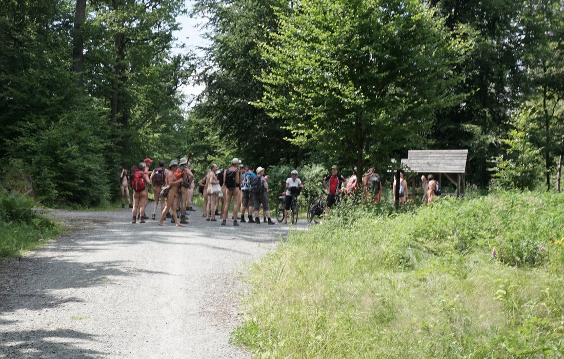 A cycling family interviews us, they learn about the naturist lifestyle, and wish us a nice hike in the buff